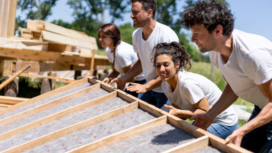 Volunteers working hard at a charity construction project