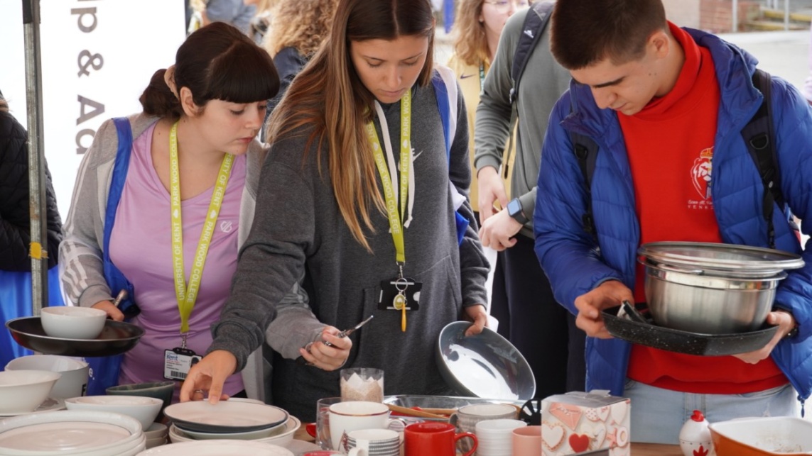 Students at The University of Kent choosing cooking utensils at the Campus Pantry.