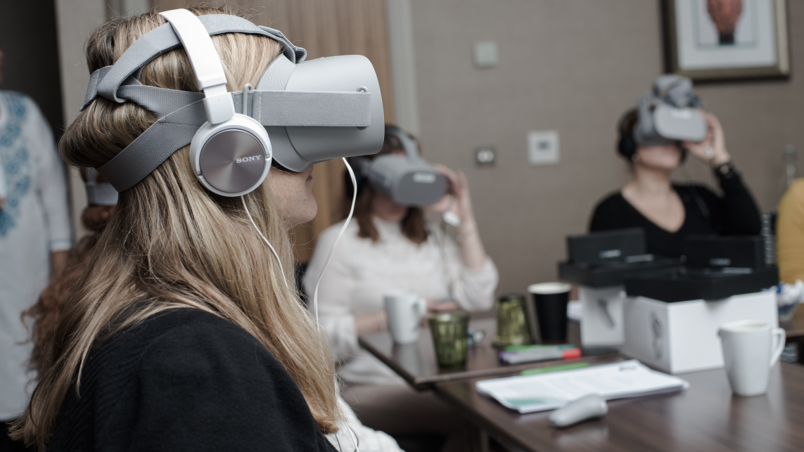 Image of three women using VR headsets