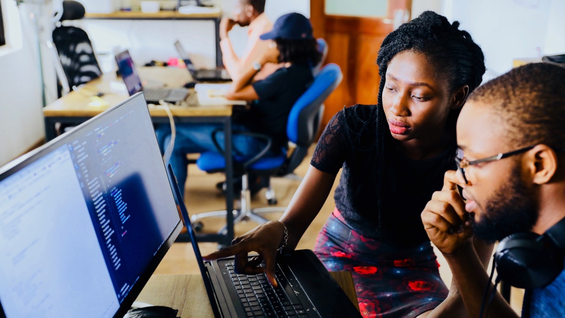 Two students look at a desktop