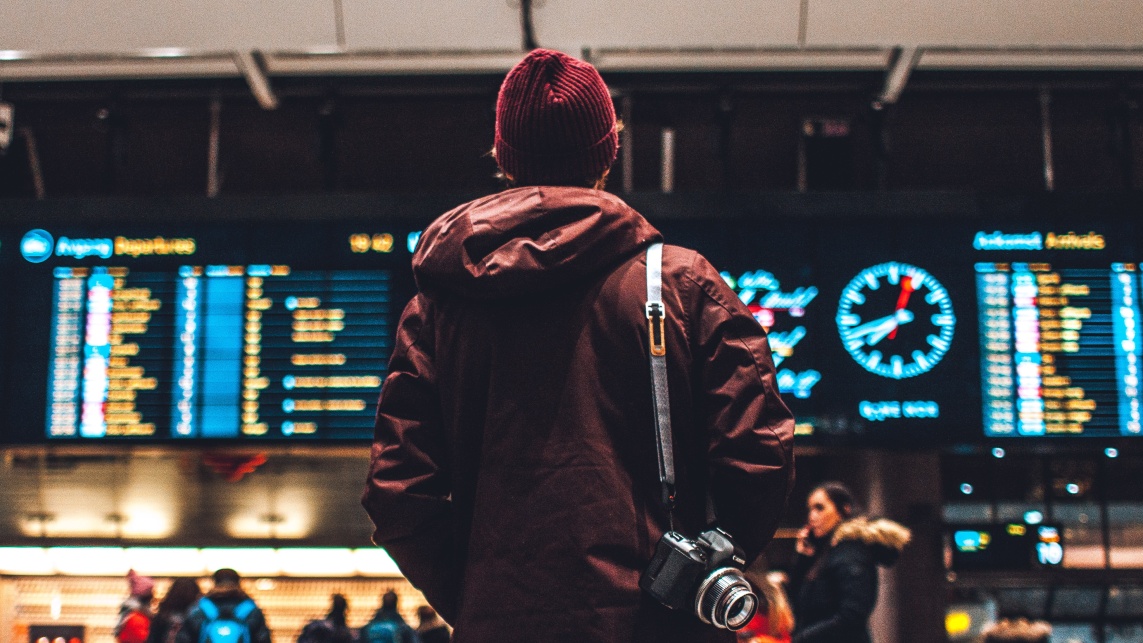 Person looking at board in station