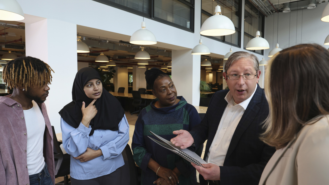 Diverse group of business people discussing in office