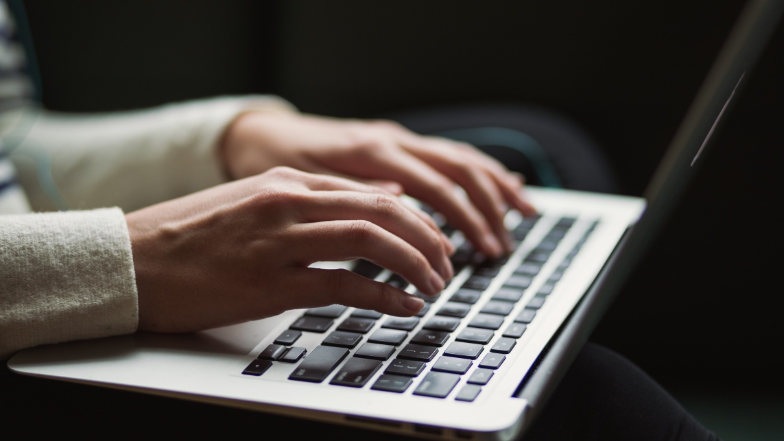 Person typing on a laptop