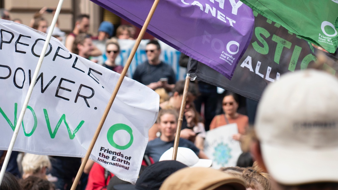 Climate protesters with posters