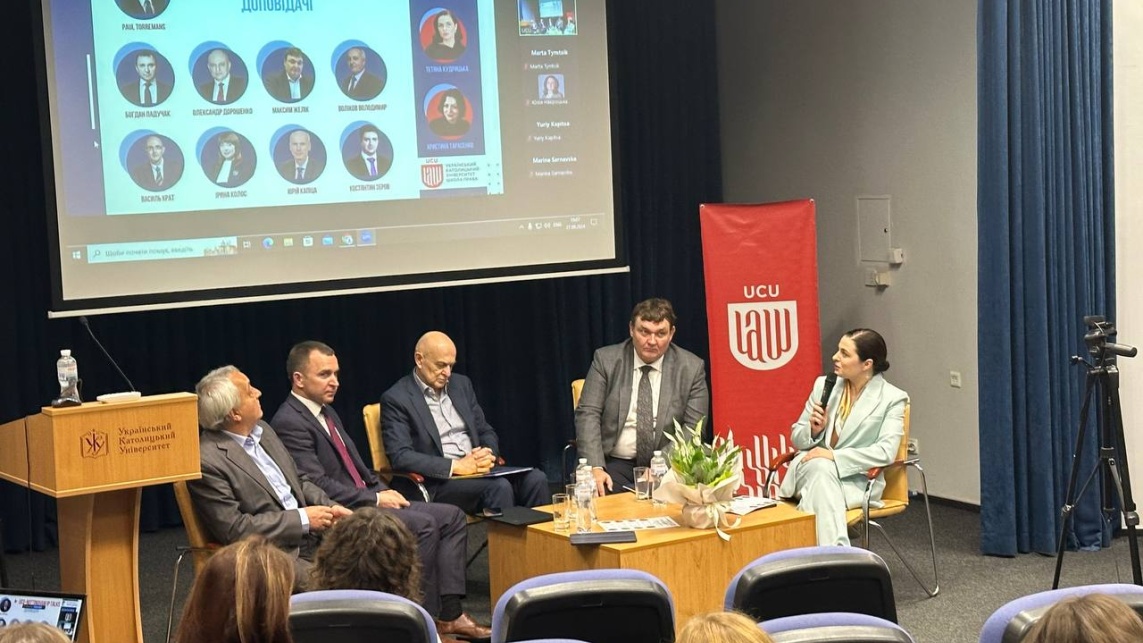 A panel of speakers sitting before an audience at the Nottingham Talks IP event in September 2024.