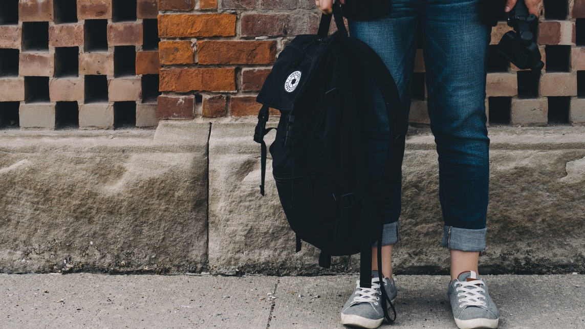 A person holding a bag