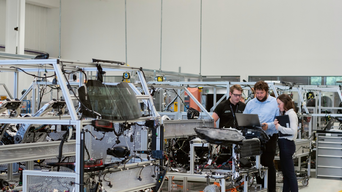 Three engineers working on software