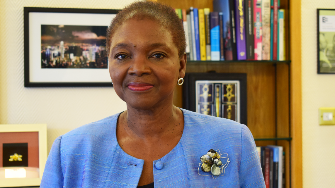 Baroness Valerie Amos in an office. She is wearing blue and smiling at the camera.