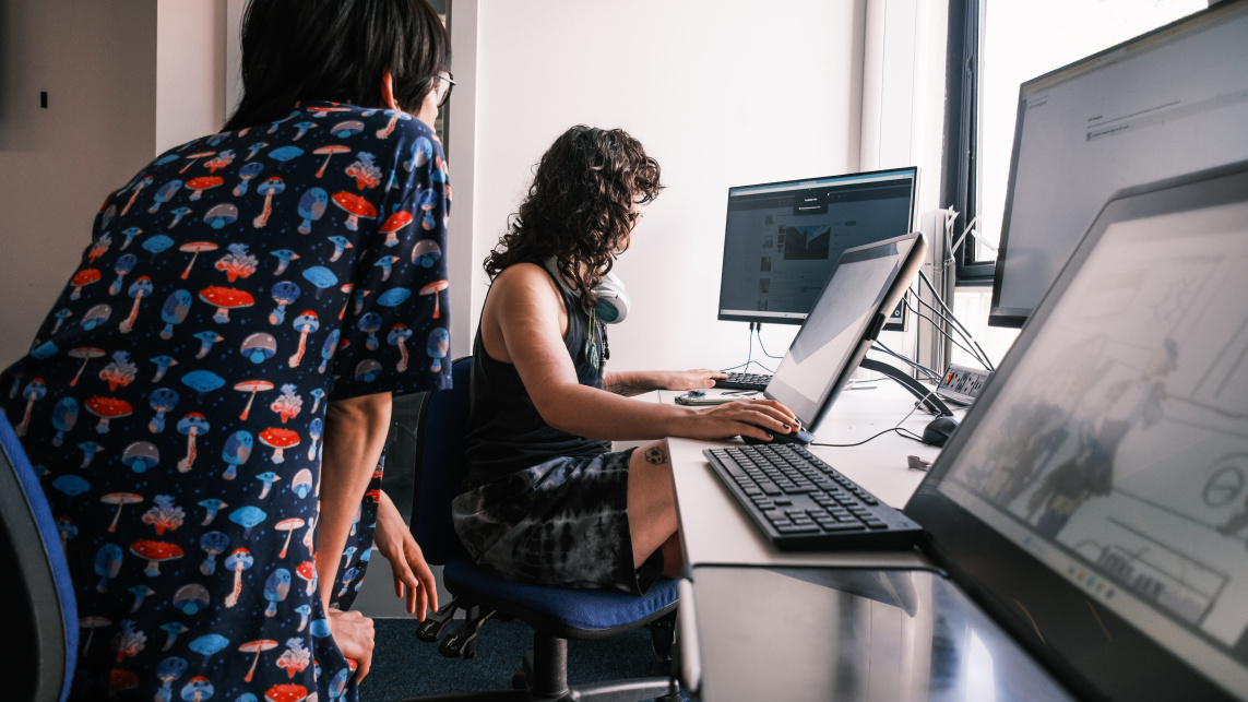 Students work together in a game design studio