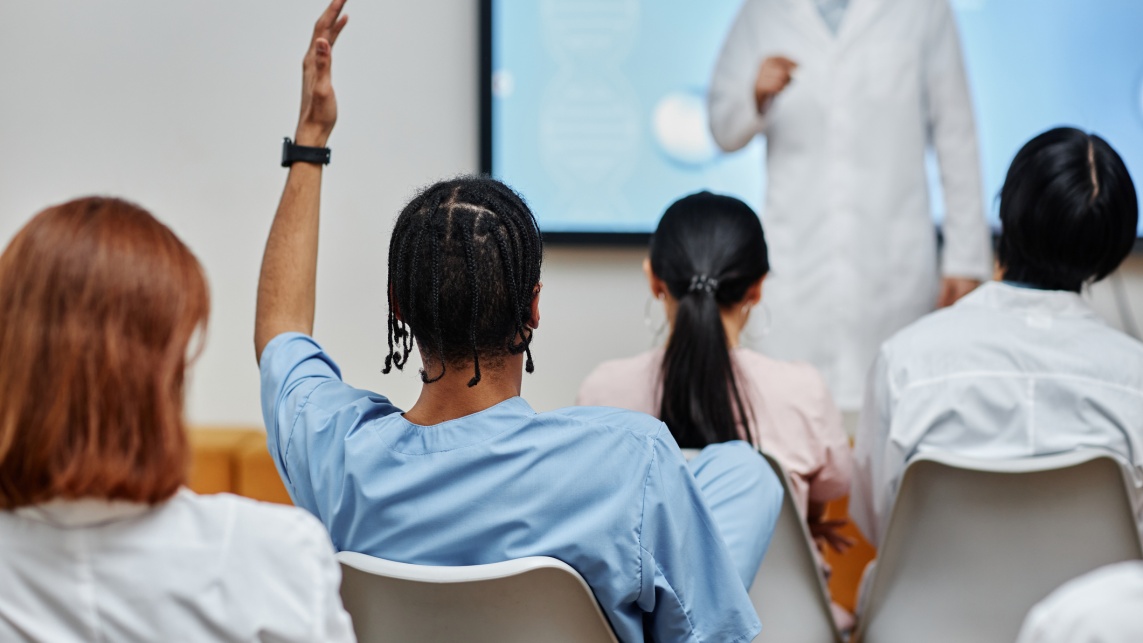 Students in a seminar facing the board.