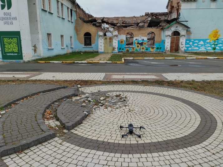 The survey drone with the damaged Central House of Culture in Irpin