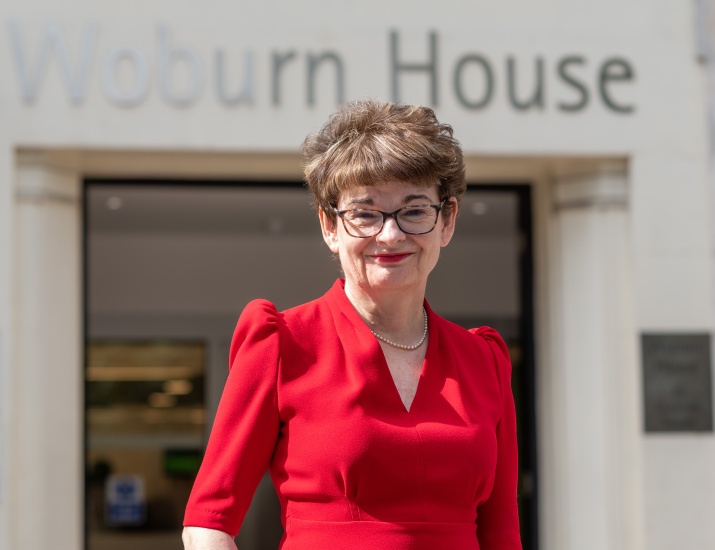 Sally Mapstone standing outside Woburn House.