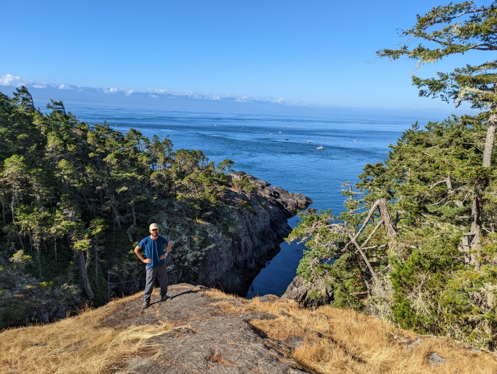 Image of Alex in front of a national park on his internship in Canada