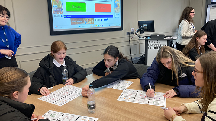 University of Hull, Preparing future leaders with future thinking workshop with kids sitting around a table.