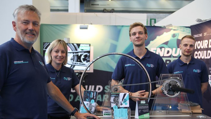 New Motion Labs Team stand around a table of equipment at Exeter University