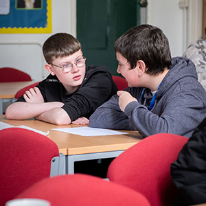University of Gloucestershire event with pupils sitting at a table