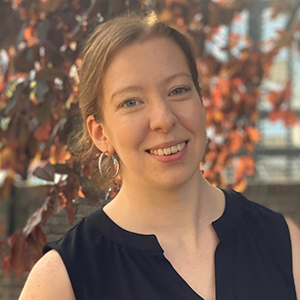 Abigail Whiteley smiling against an autumnal background