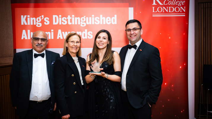Andreia Trigo at King's College London's Distinguished Alumni Awards. She is holding her award.