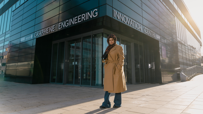 Dr Beenish Siddique standing outside the University of Manchester's Graphene Engineering Innovation Centre