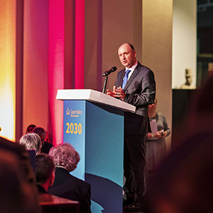 Professor Colin Bailey CBE giving a speech to an audience