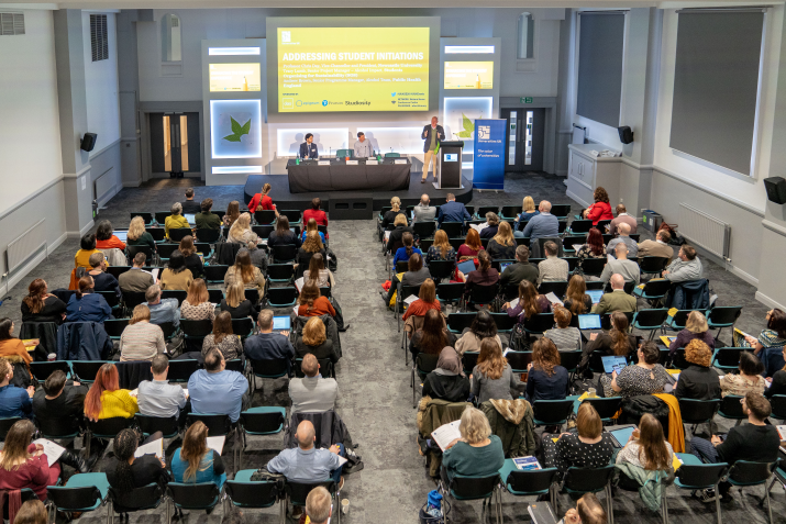 Birds eye view of a conference taking place with lots of delegates