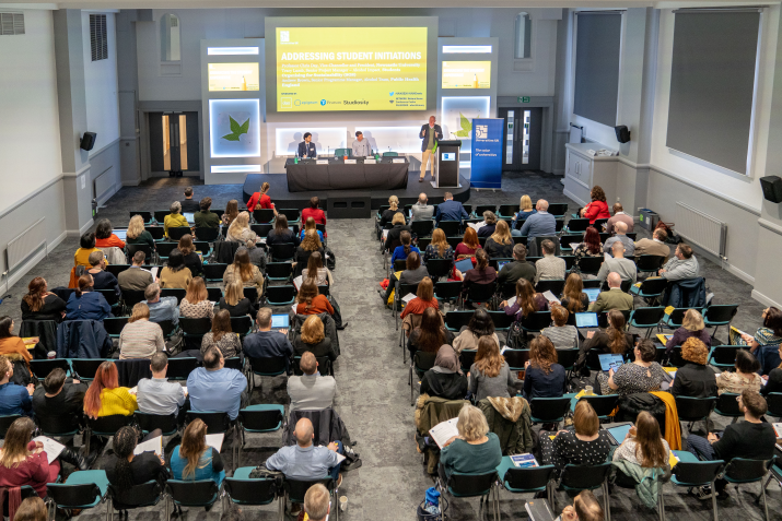 Birds eye view of a conference taking place with lots of delegates 