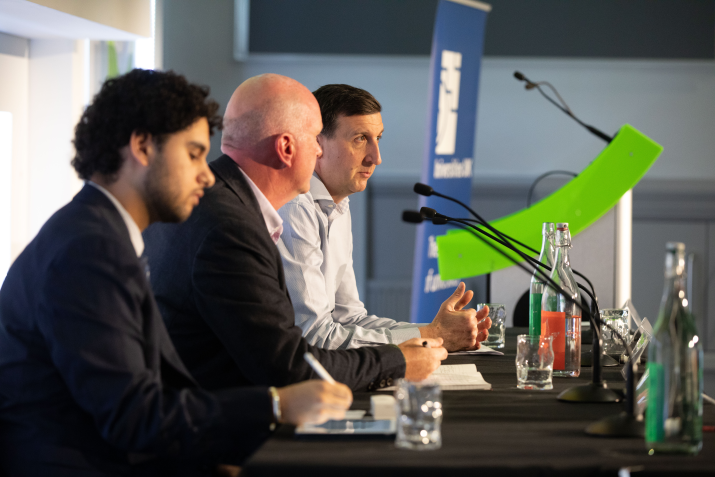 Panel of three listening to audience questions