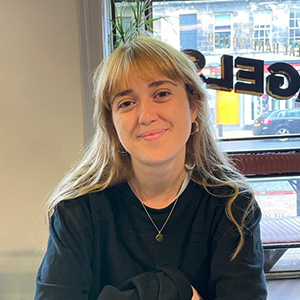Dana sitting in a cafe