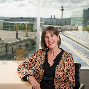 Professor Dame Janet Beer with the backdrop of the City of Liverpool