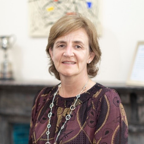 Lesley Haig sitting in a university office