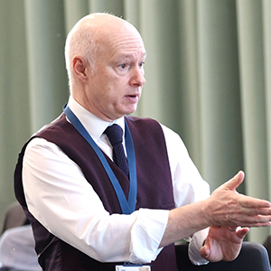 Professor Paul Bartholomew in conversation at an event.