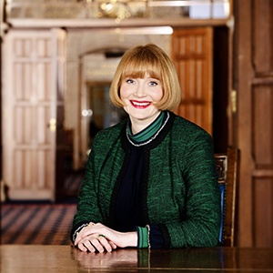 Rachel Sandison sitting in a wood panelled room