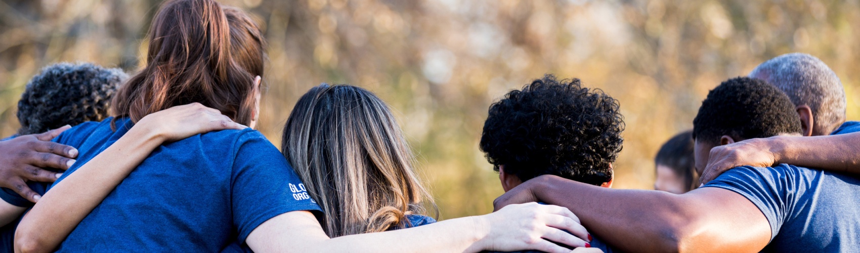 Friends linking arms in unity