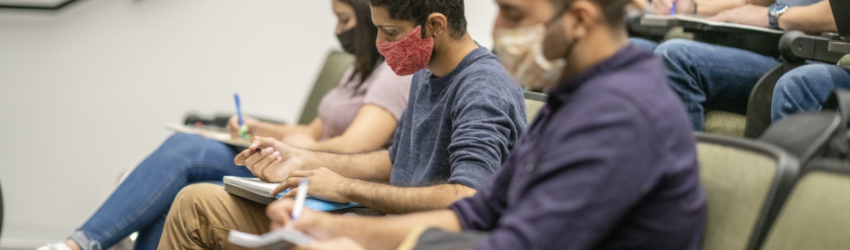College Students wearing masks in a lecture hall