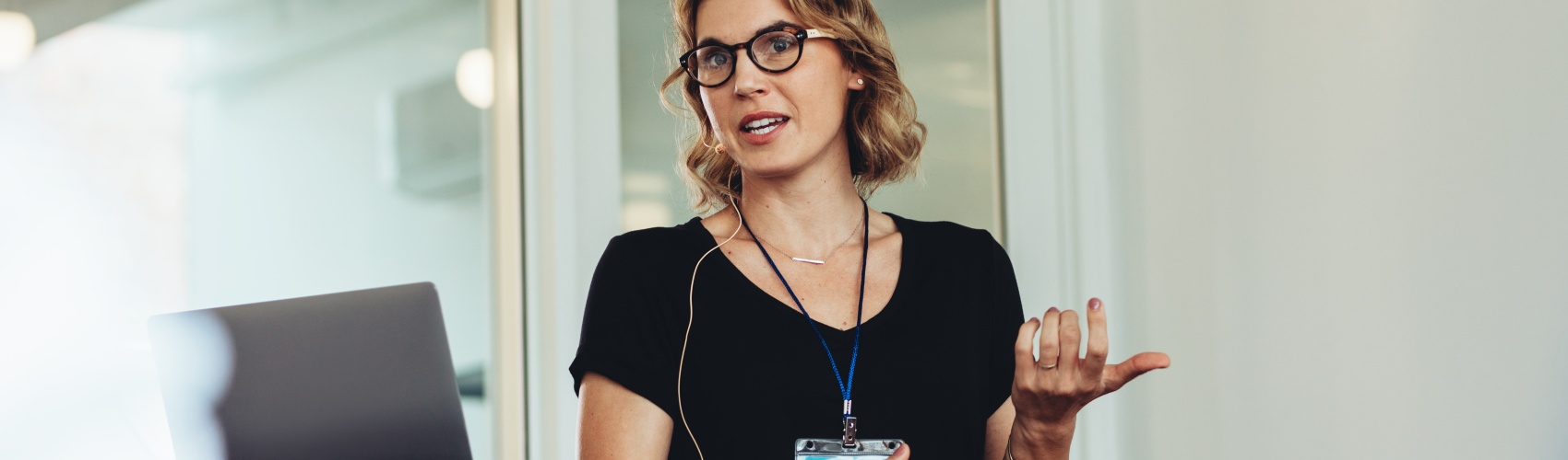 A woman stood at a podium giving a speech