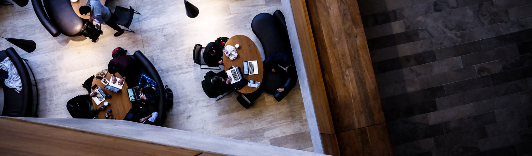 A lecture hall, with students studying in it, pictured from above looking down at the students