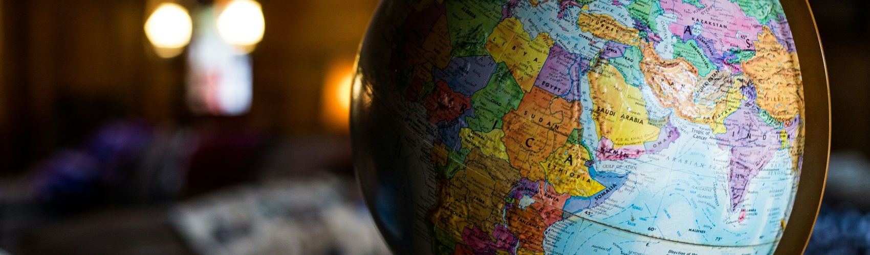 A globe sits on a desk 