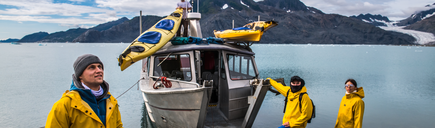 A group of researchers about to board a boat on an expedition