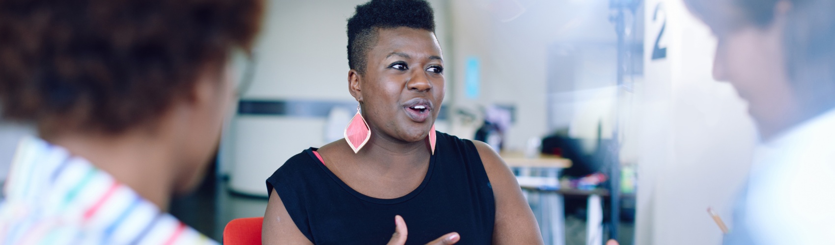 Woman sharing ideas with colleagues