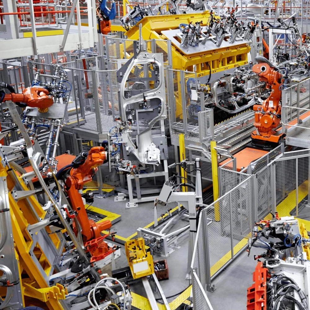 Factory making car parts using robots and other machinery. 