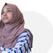Maisha Sadia folding her arms and looking to the left.