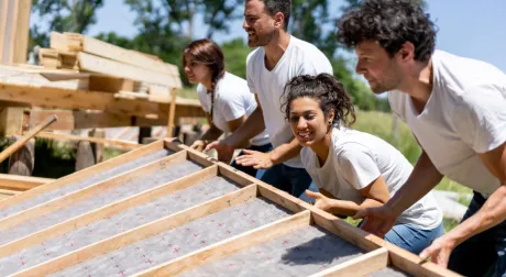 Volunteers working hard at a charity construction project